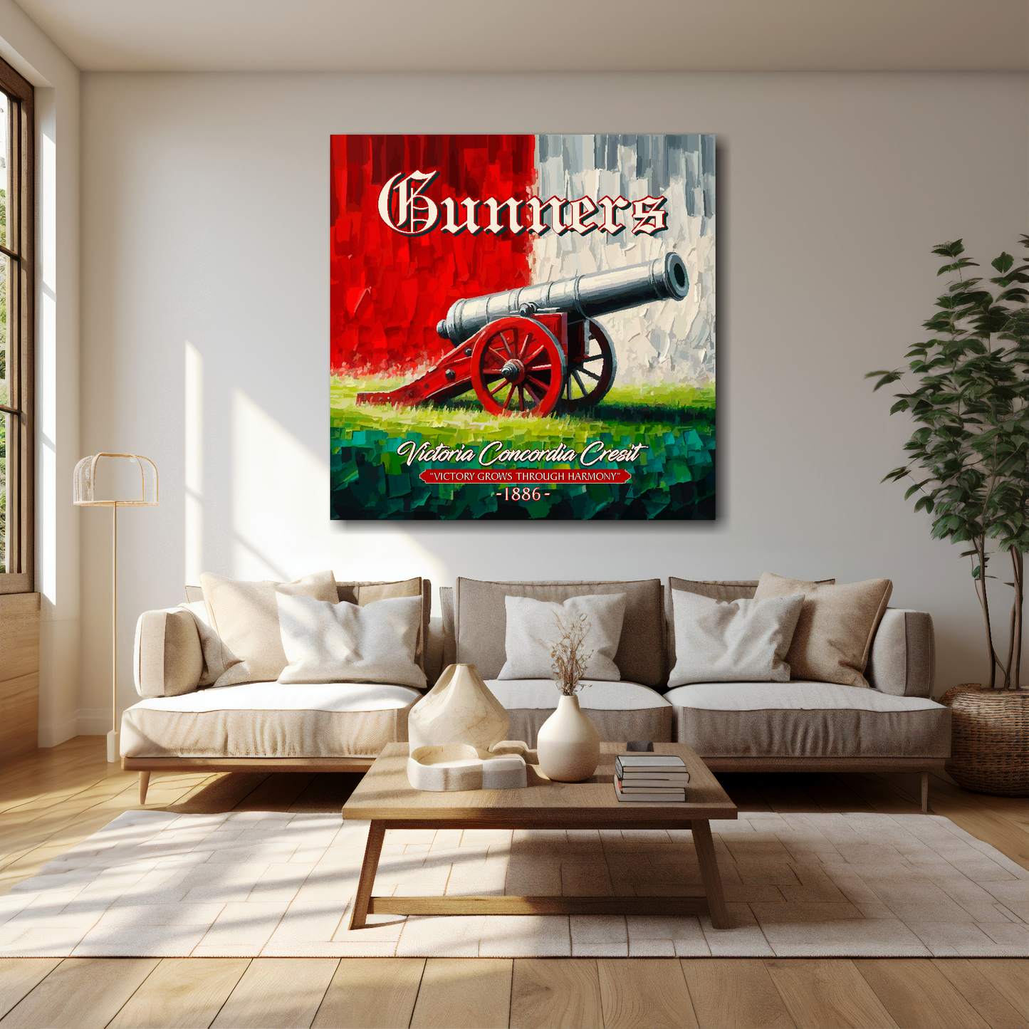 Arsenal inspired canvas wall art. A large cannon centred on a red and white backround. The word Gunners above, Victoria Concordia Cresit, 'Victory Grows Through Harmony' 1886 text below. Mounted on a cream painted wall above a brown sofa.