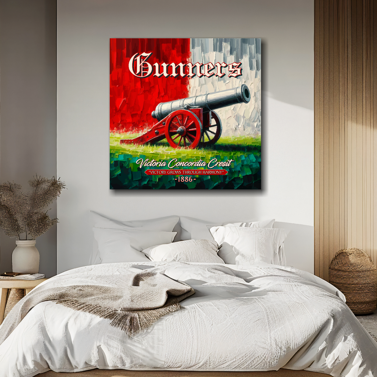 Arsenal inspired canvas wall art. A large cannon centred on a red and white backround. The word Gunners above, Victoria Concordia Cresit, 'Victory Grows Through Harmony' 1886 text below. Mounted on a cream painted bedroom wall above a bed.