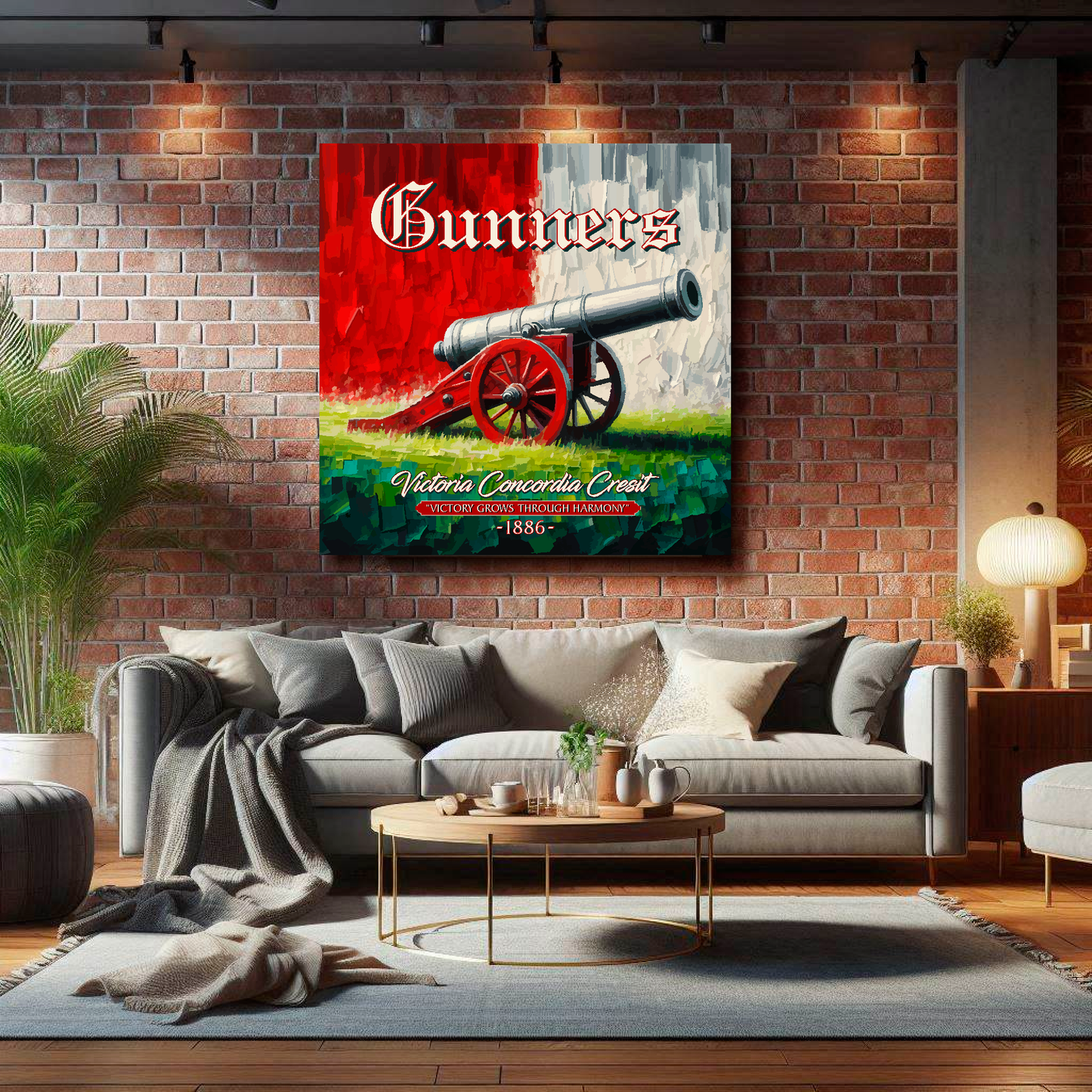 Arsenal inspired canvas wall art. A large cannon centred on a red and white backround. The word Gunners above, Victoria Concordia Cresit, 'Victory Grows Through Harmony' 1886 text below. Mounted on a lounge brick wall above a grey sofa.