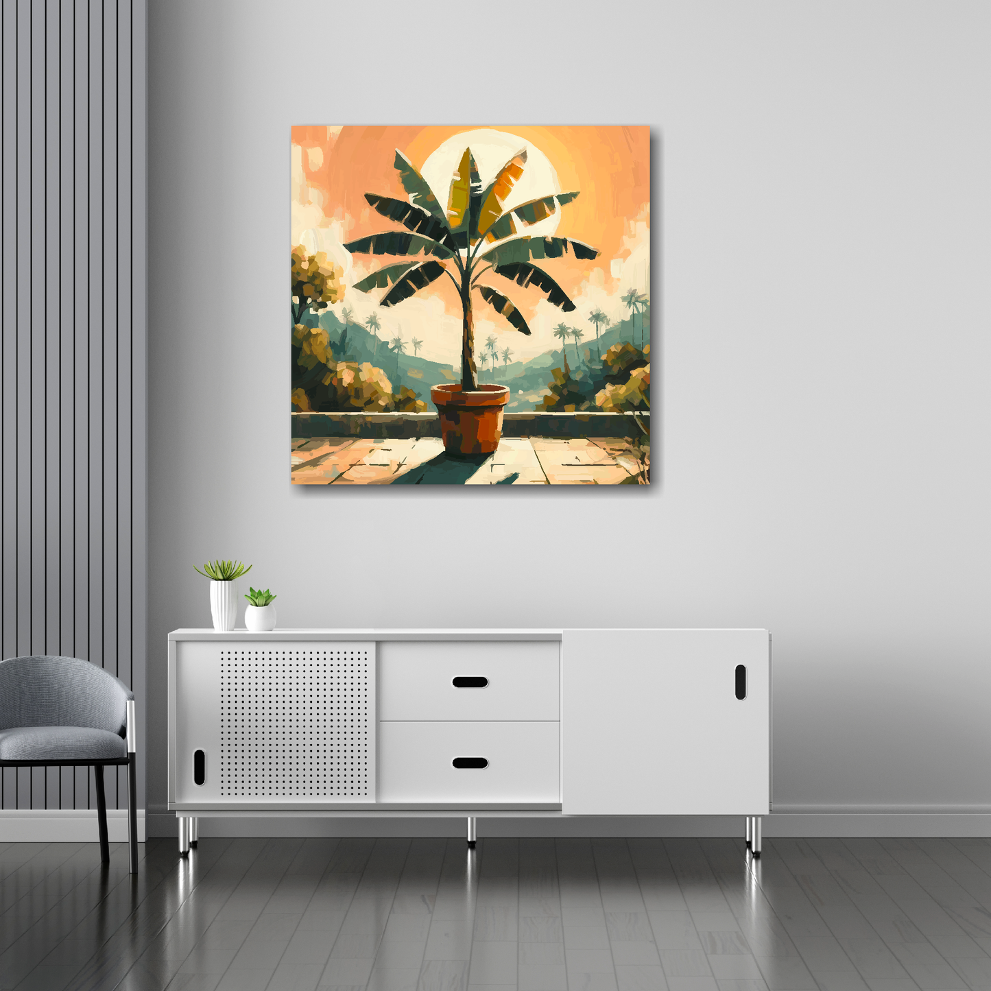 30 inch by 30 inch square canvas featuring a Banana Tree. Mounted on a white wall above a white sideboard.