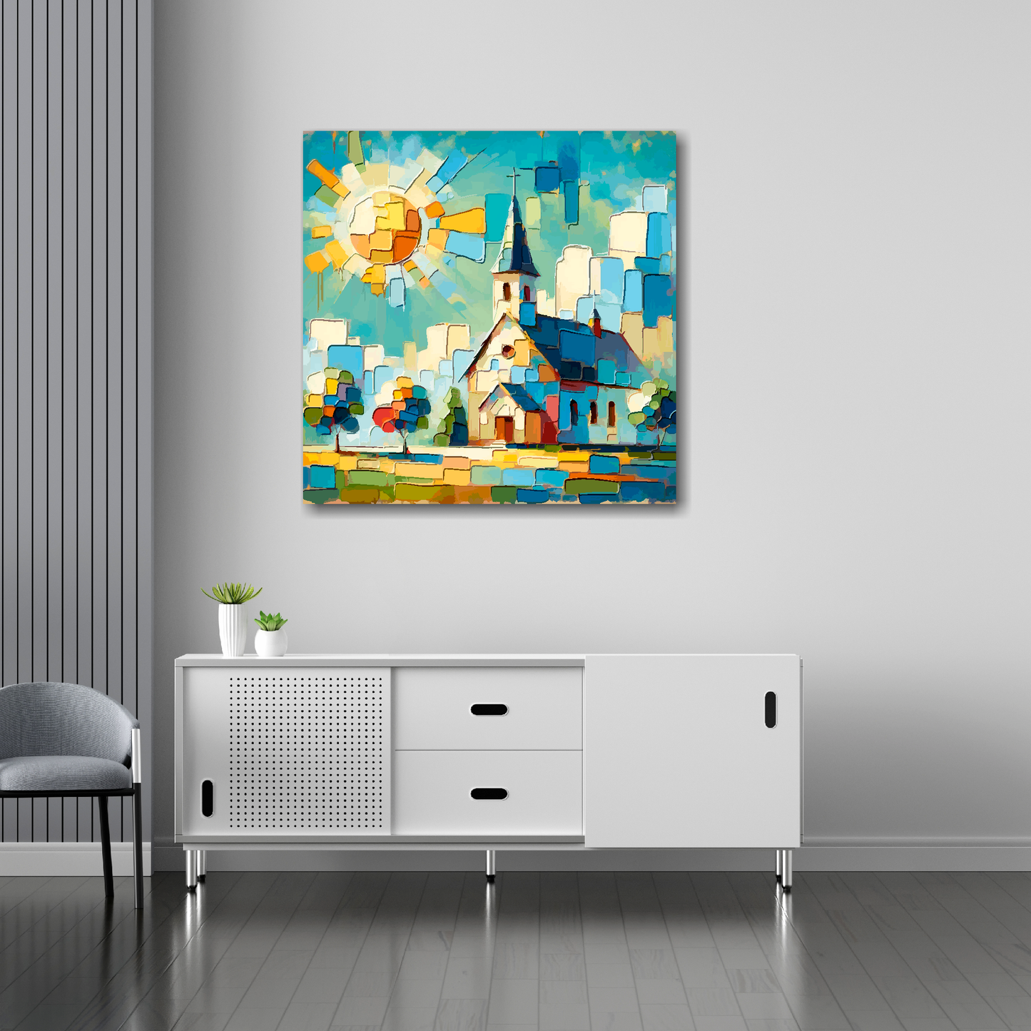 30 inch by 30 inch square canvas featuring a colourful church landscape. Mounted on a white wall above a white sideboard.