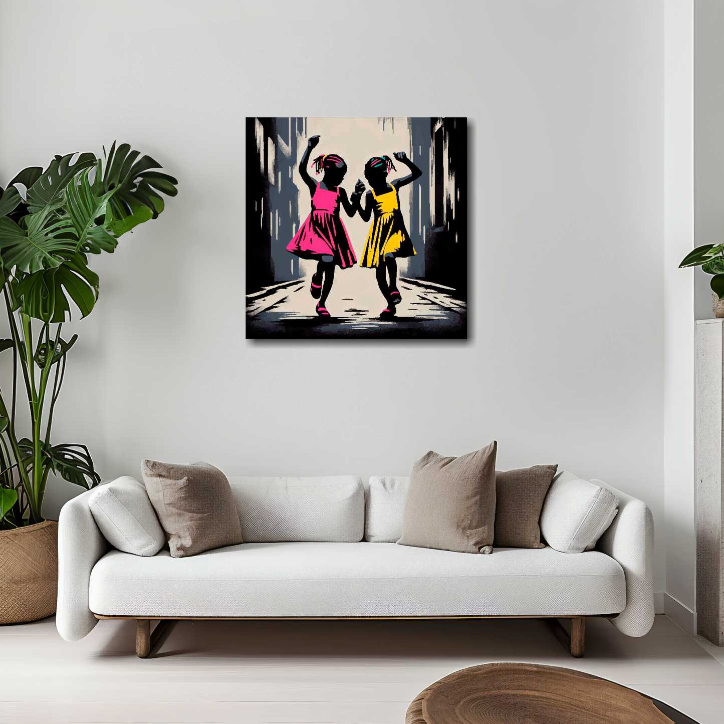 20 inch by 20 inch square canvas featuring a two African girls dancing in the street. Mounted on a white wall above a white sofa with decorative pillows.