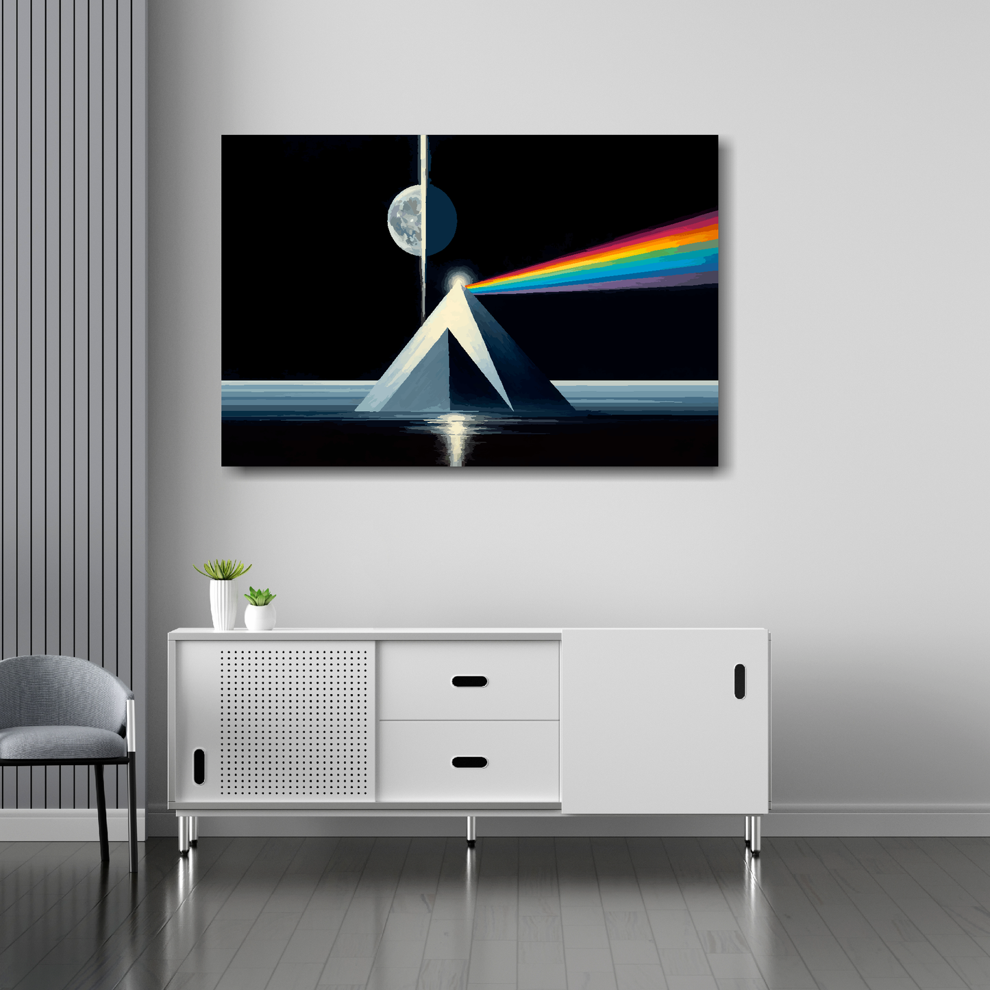 36 inch by 24 inch abstract canvas print of a futuristic moon and pyramids. Mounted on a white wall above a white sideboard.