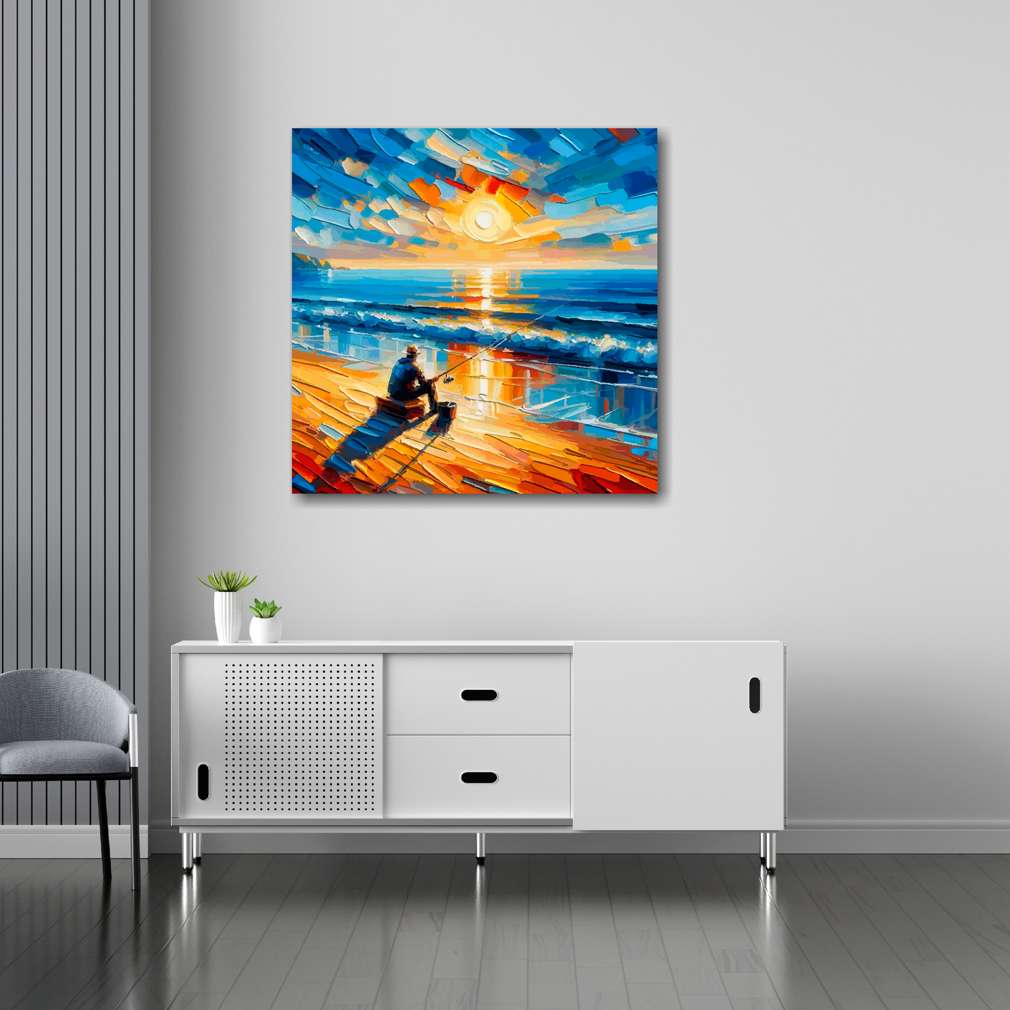 30 inch by 30 inch square canvas featuring a lone angler on a sun setting beach. Mounted on a white wall above a white sideboard.