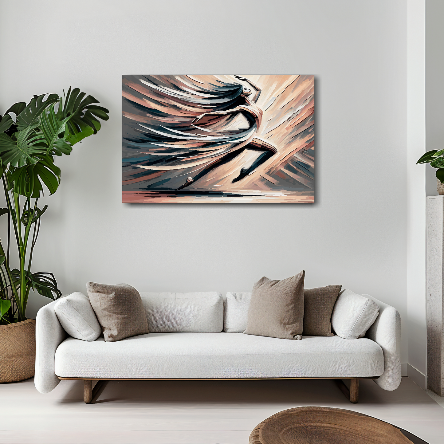 30 inch by 20 inch abstract canvas print of a woman dancing. Mounted on a white wall above a white sofa with decorative pillows.