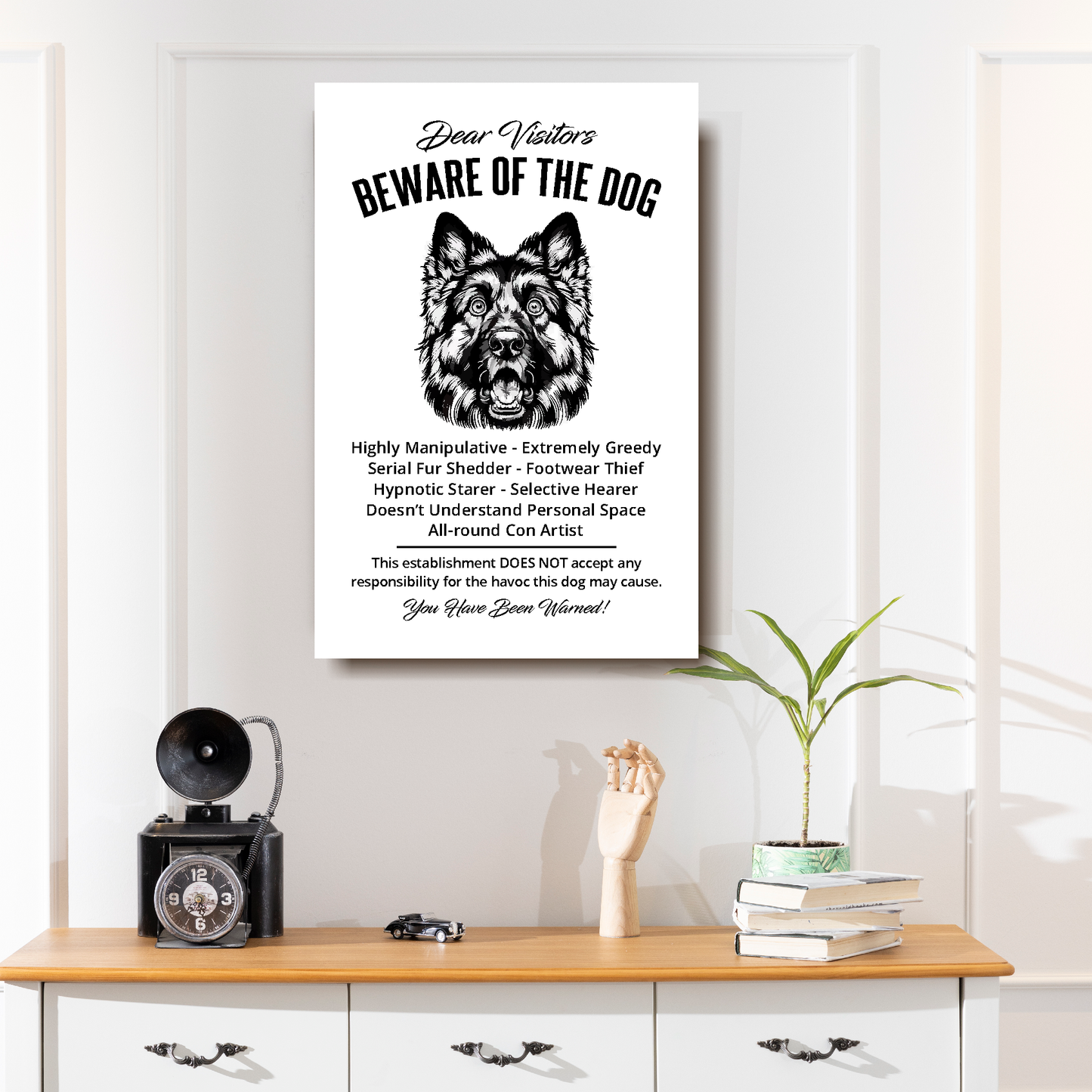 A funny German Shepherd 'Beware of the Dog' disclaimer notice. Black text and dog image on a white background. Available in 4 Canvas sizes. A great gift for dog owners.