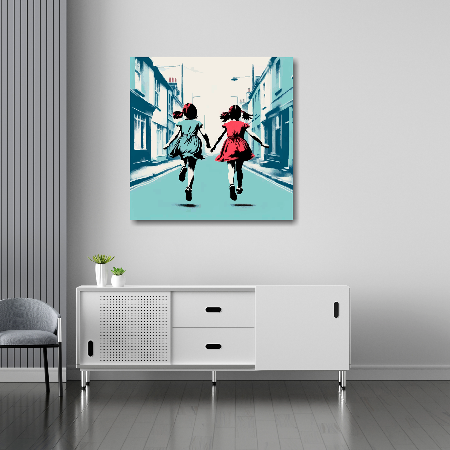 30 inch by 30 inch square canvas featuring a two girl best friends running in the street. Mounted on a white wall above a white sideboard.