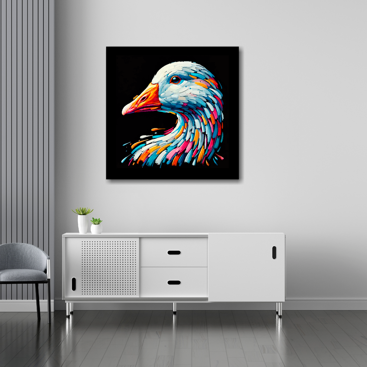 30 inch by 30 inch square canvas of a colourful Goose head portrait on a black background. Mounted on a white wall above a white sideboard.