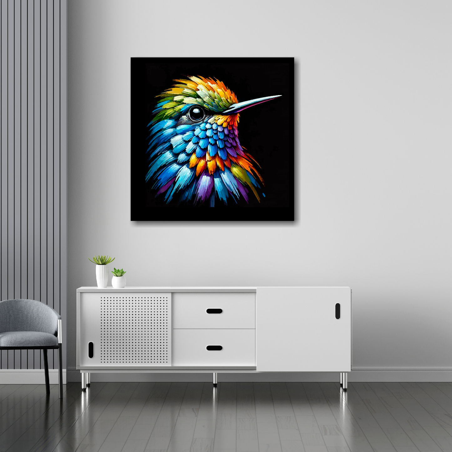 30 inch by 30 inch square canvas of a colourful Hummingbird portrait on a black background. Mounted on a white wall above a white sideboard.