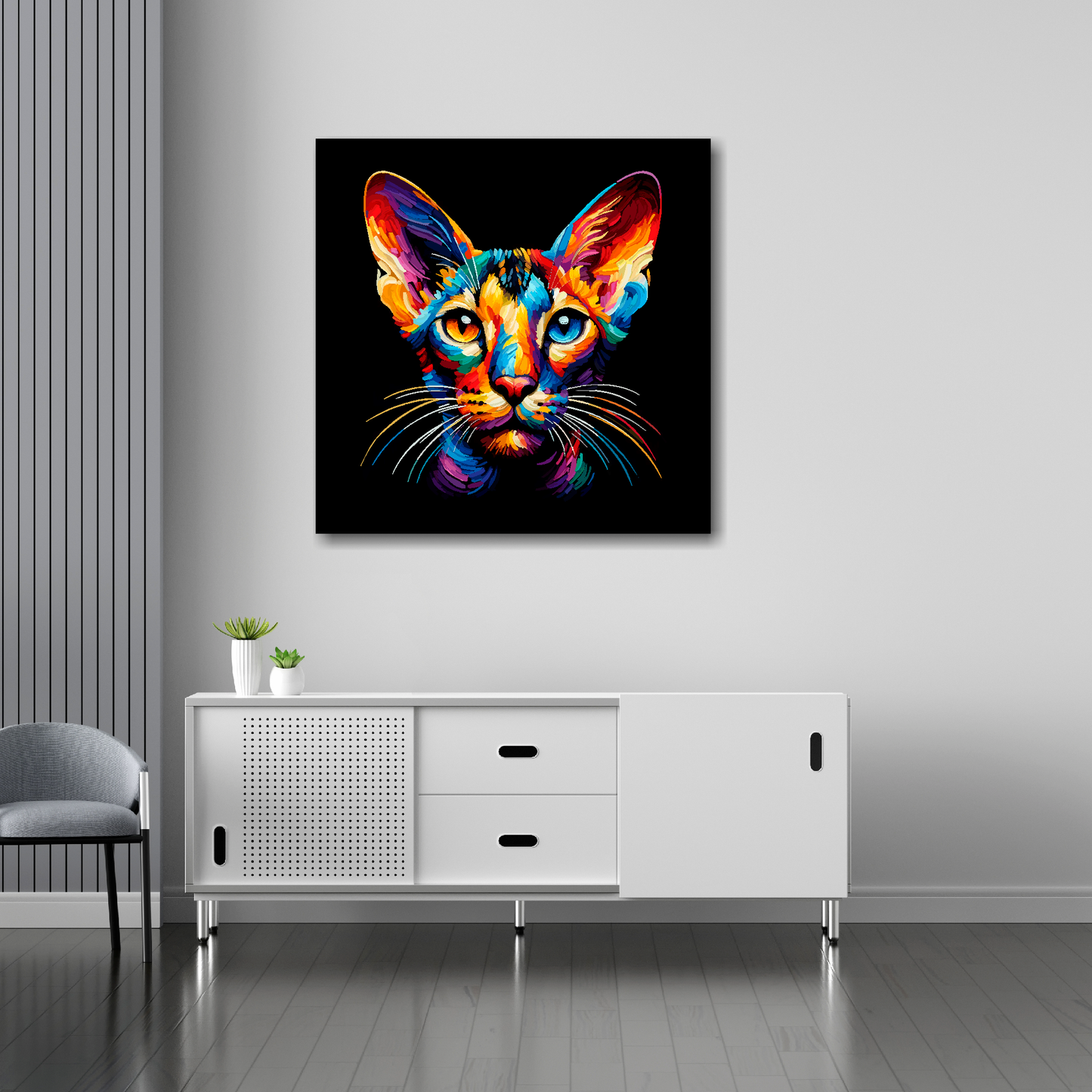 30 inch by 30 inch square canvas of a colourful Oriental shorthair cat head portrait on a black background. Mounted on a white wall above a white sideboard.