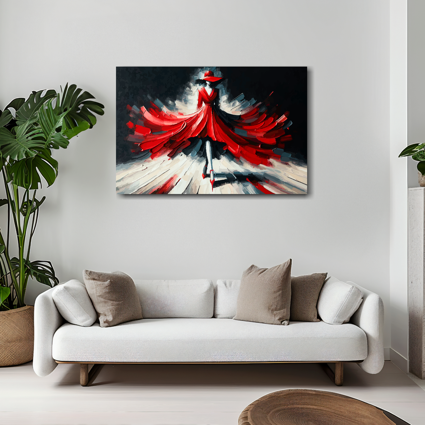30 inch by 20 inch abstract canvas print of a woman wearing a red fashion dress. Mounted on a white wall above a white sofa with decorative pillows.