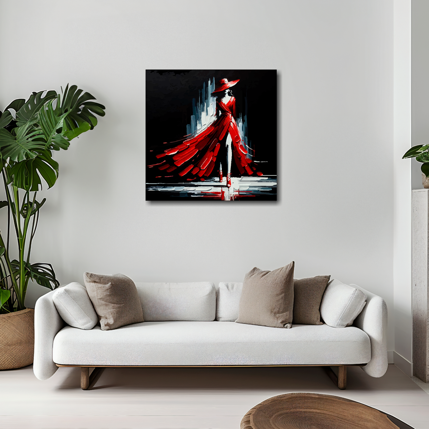 20 inch by 20 inch square canvas featuring a red fashion dress. Mounted on a white wall above a white sofa with decorative pillows.