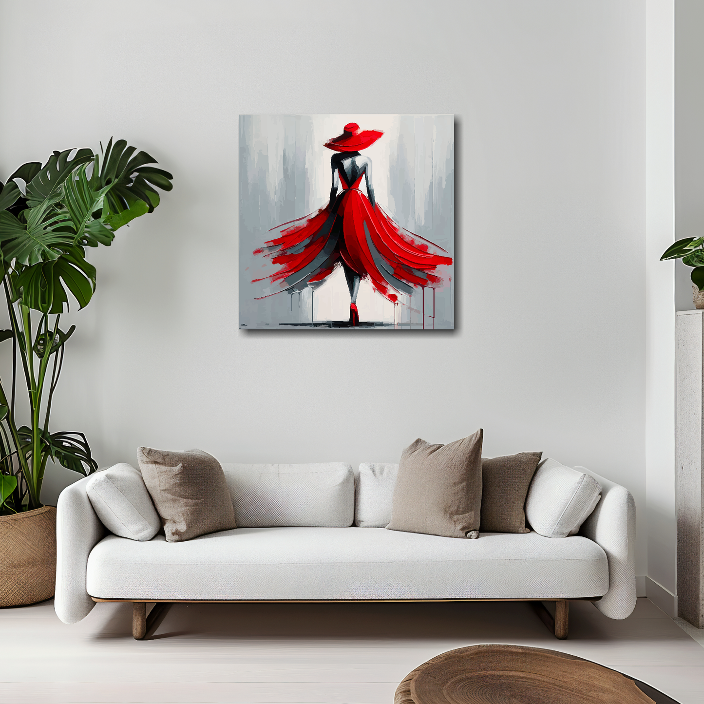 20 inch by 20 inch canvas mounted on a white living room wall above a white sofa. Featuring a woman wearing a fashionable scarlett dress and hat on a light painted grey background.