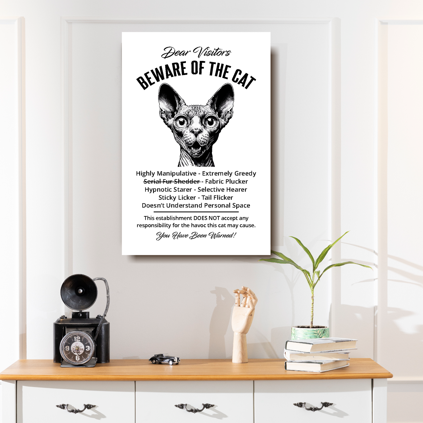 A funny Sphynx 'Beware of the Cat' disclaimer notice. Black text and dog image on a white background. Available in 4 Canvas sizes. A great gift for cat owners.