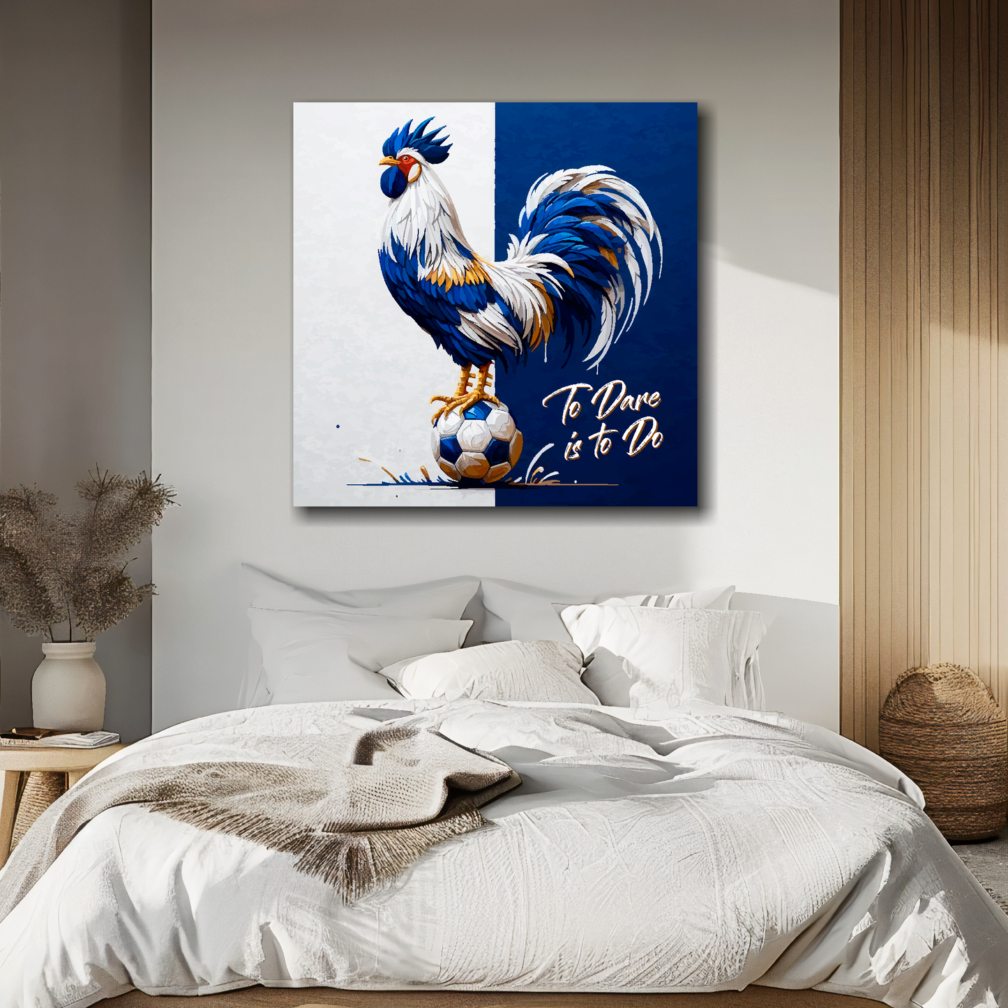 Tottenham Hotspur inspired canvas art. A colourful cockeral stands on a football on a white and navy blue halved background. Text saying, 'To Dare is to Do' in the bottom right hand corner. Hanging on a bedroom wall above a bed.