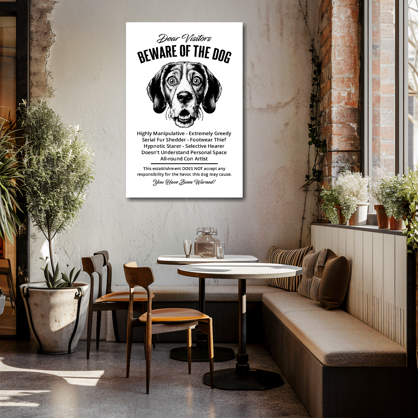 24 inch by 36 inch canvas print of a funny Beagle 'Beware of the Dog' notice. Mounted on a cream cafe wall above tables and chairs.
