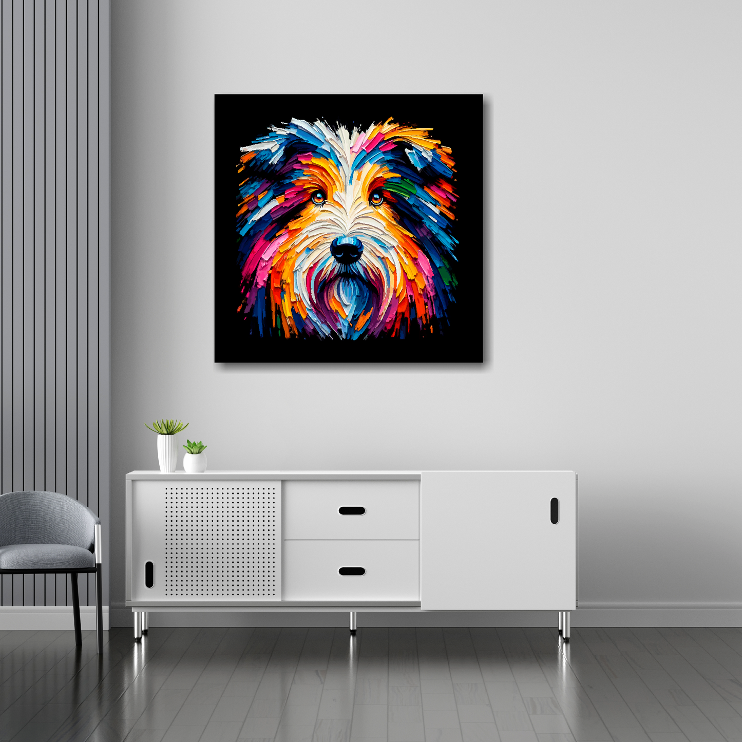 30 inch by 30 inch square canvas of a colourful Bearded Collie head portrait on a black background. Mounted on a white wall above a white sideboard.