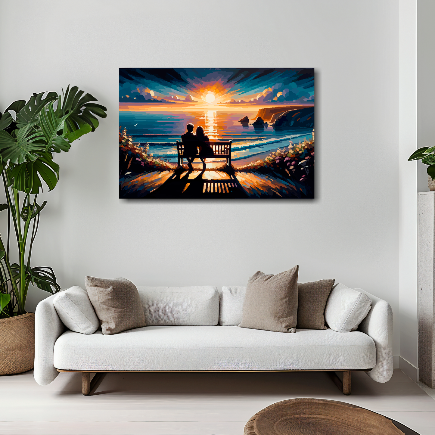 30 inch by 20 inch abstract canvas print of a couple watching a sunset. Mounted on a white wall above a white sofa with decorative pillows.