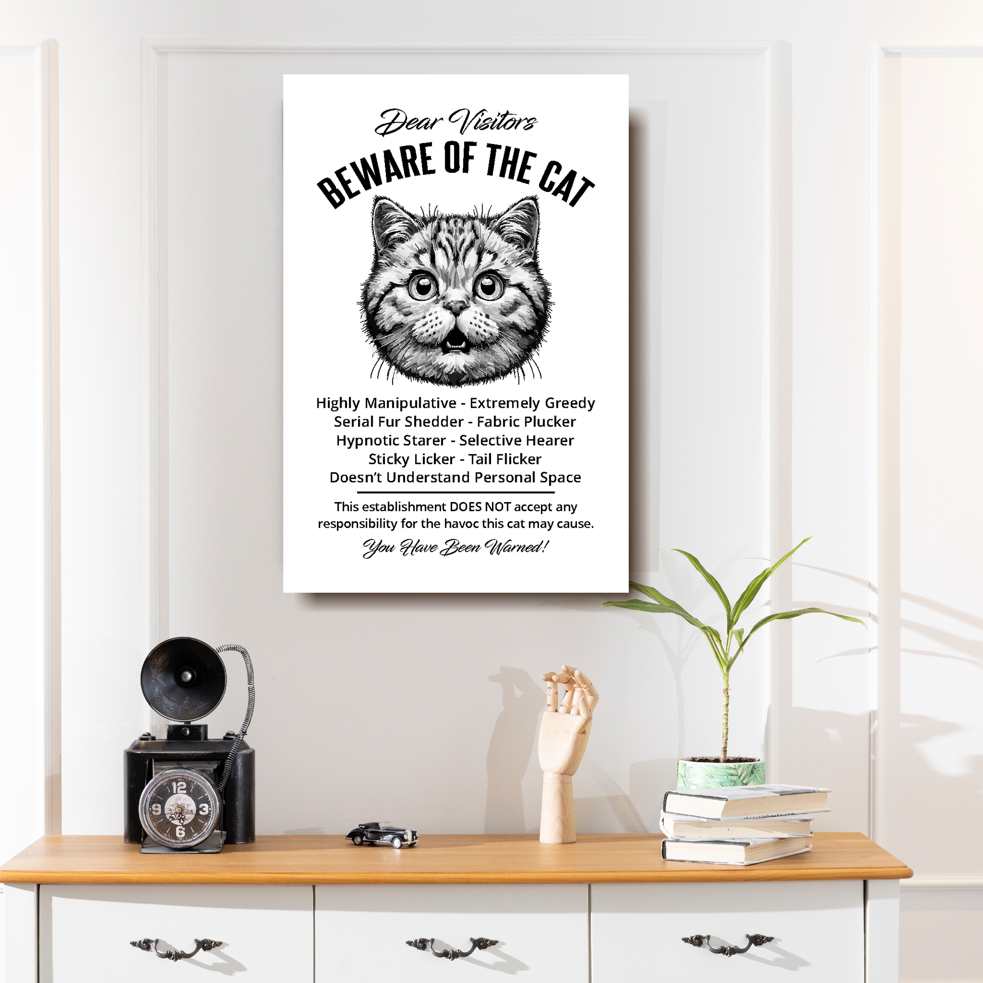 A funny British Shorthair 'Beware of the Cat' disclaimer notice. Black text and dog image on a white background. Available in 4 Canvas sizes. A great gift for cat owners.