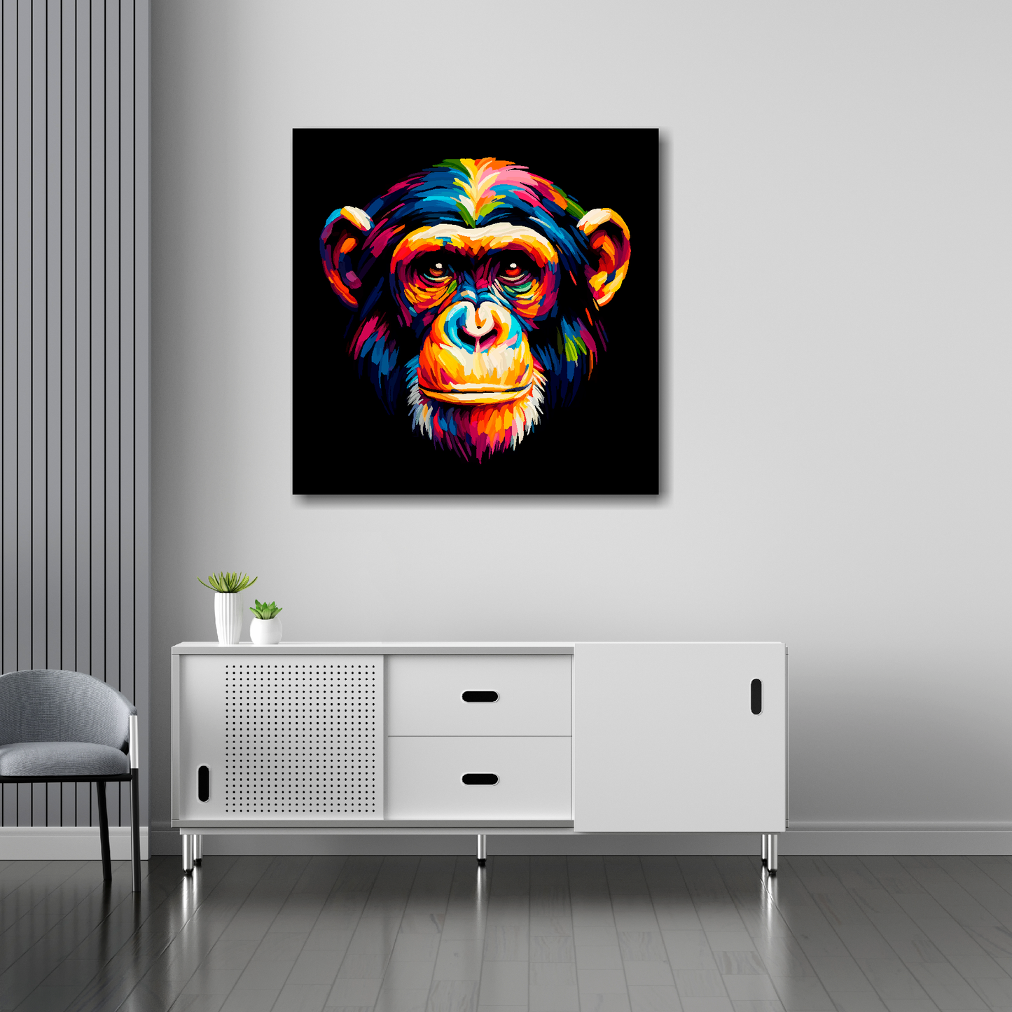 30 inch by 30 inch square canvas of a colourful Chimpanzee portrait on a black background. Mounted on a white wall above a white sideboard.