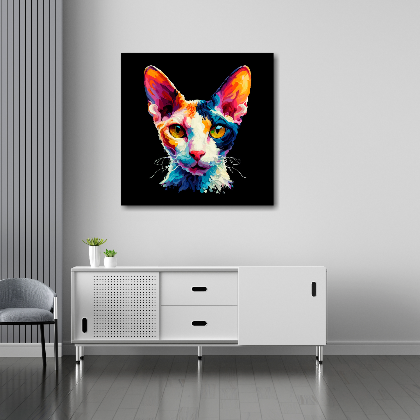 30 inch by 30 inch square canvas of a colourful Cornish Rex cat head portrait on a black background. Mounted on a white wall above a white sideboard.