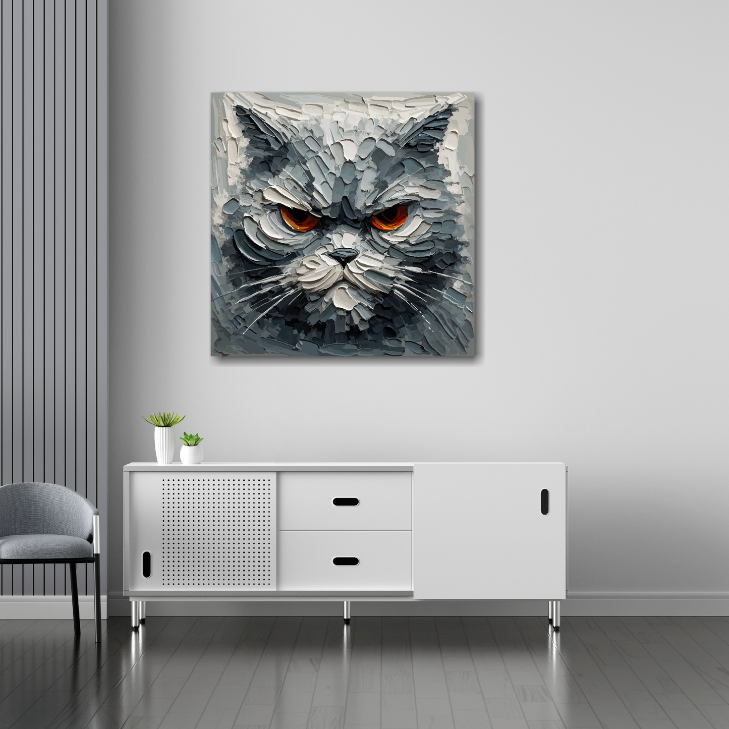 30 inch by 30 inch canvas mounted on a white living room wall above a white sideboard. Featuring a grumpy grey cat head.