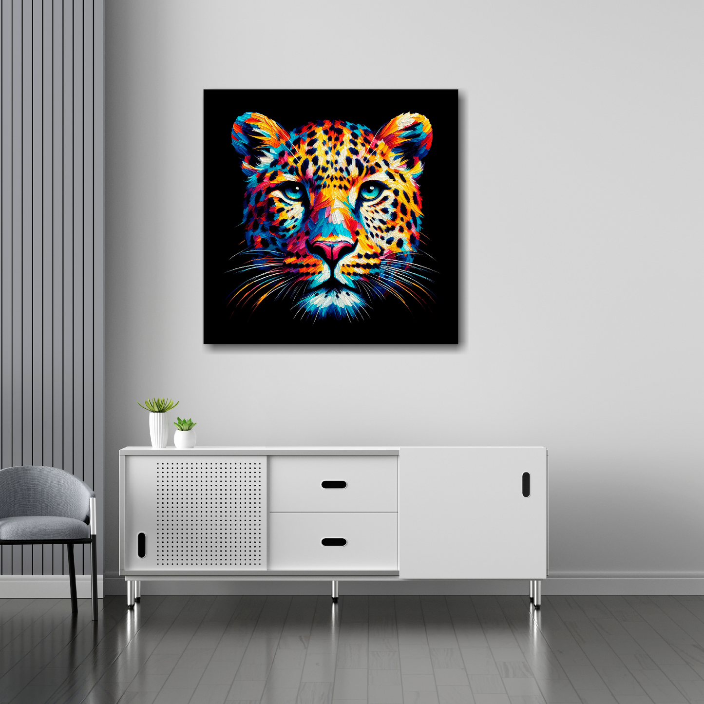 30 inch by 30 inch square canvas of a colouful Leopard head portrait on a black background. Mounted on a white wall above a white sideboard.