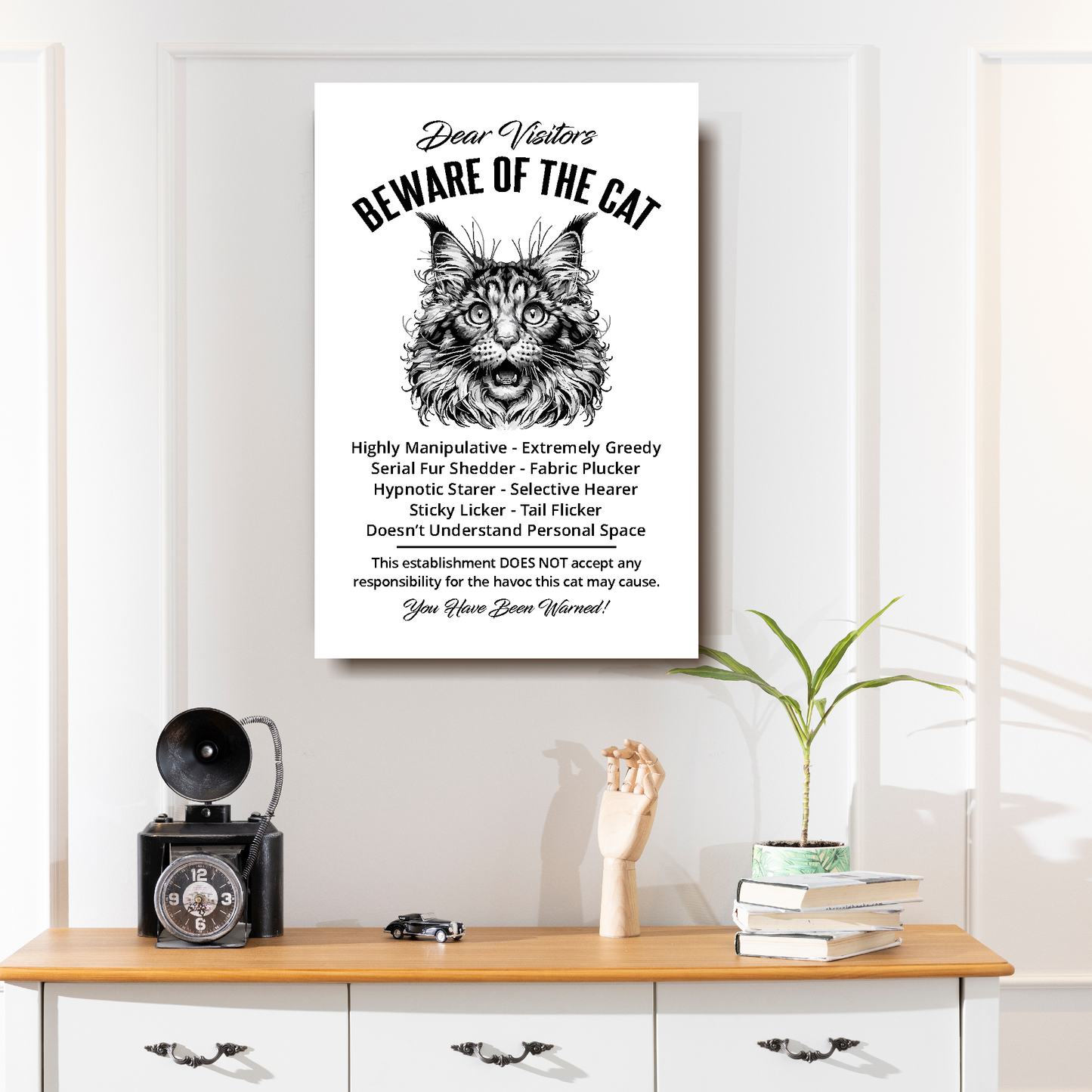 A funny Maine Coon 'Beware of the Cat' disclaimer notice. Black text and dog image on a white background. Available in 4 Canvas sizes. A great gift for cat owners.