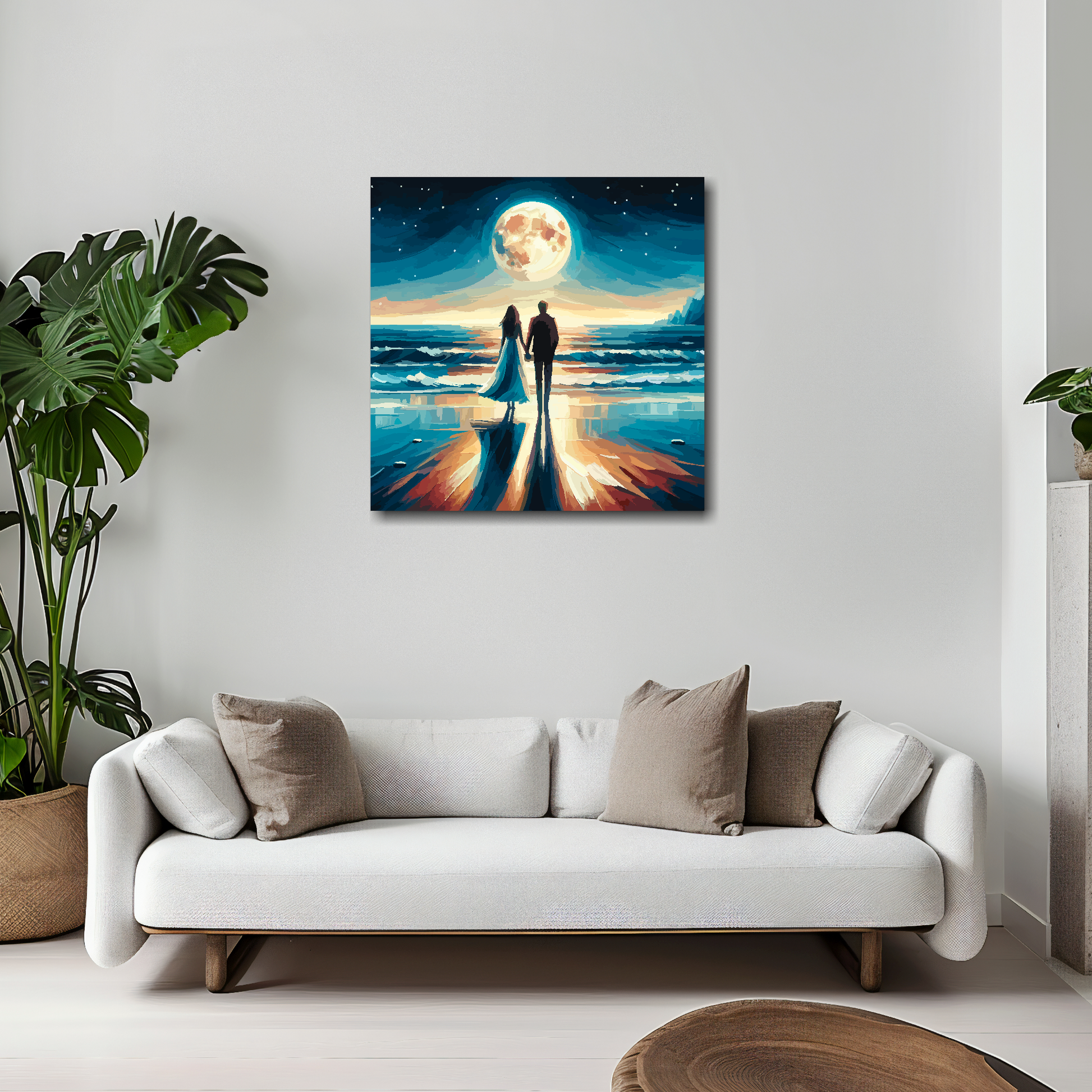 20 inch by 20 inch square canvas featuring a romantic couple standing on a moonlit beach. Mounted on a white wall above a white sofa with decorative pillows.