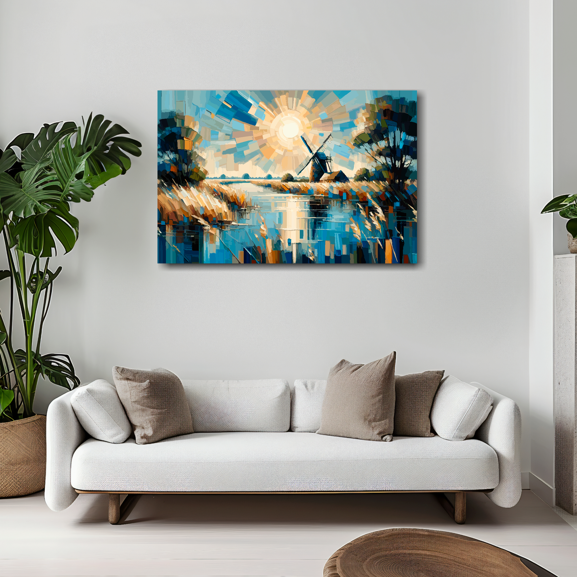 30 inch by 20 inch abstract canvas print of a Norfolk Broads landscape. Mounted on a white wall above a white sofa with decorative pillows.