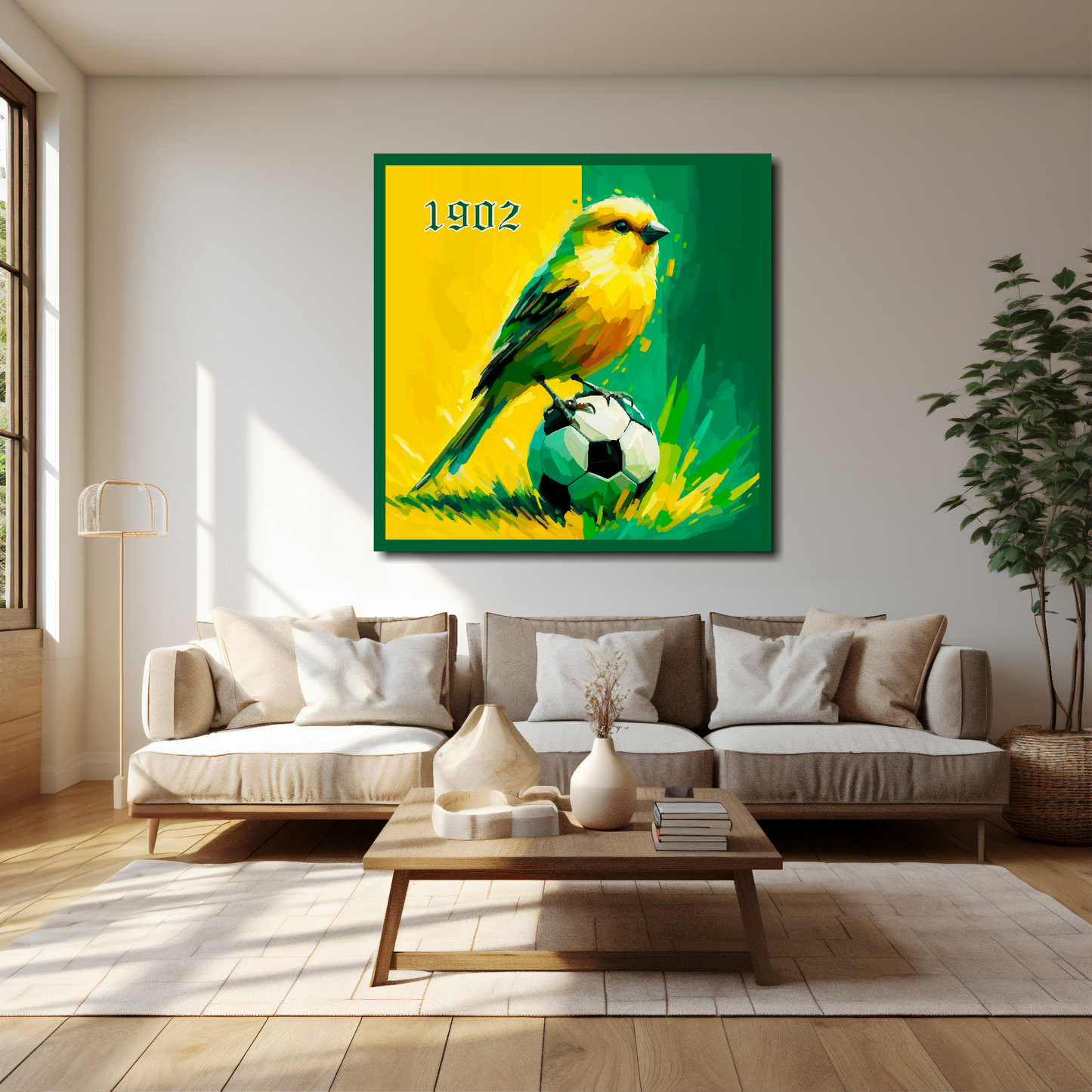 40 inch by 40 inch Norwich City FC inspired canvas, mounted on a cream living room wall above a cream sofa, featuring a Canary sitting on a football on a Yellow and Green halved background.
