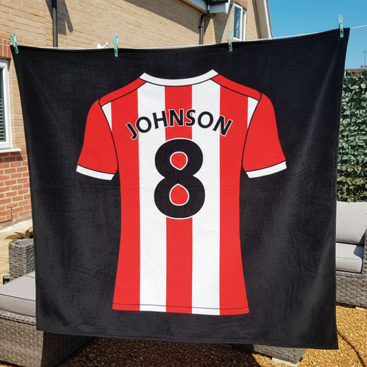 Personalised football shirt on a fleece blanket hanging on a washing line - Made in UK