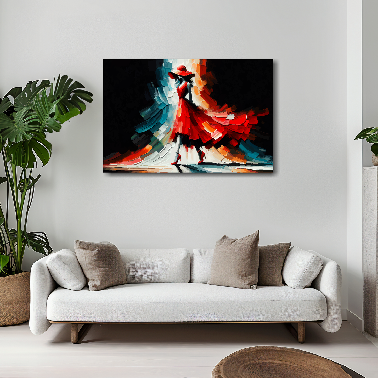 30 inch by 20 inch abstract canvas print of a woman in a red fashion dress. Mounted on a white wall above a white sofa with decorative pillows.