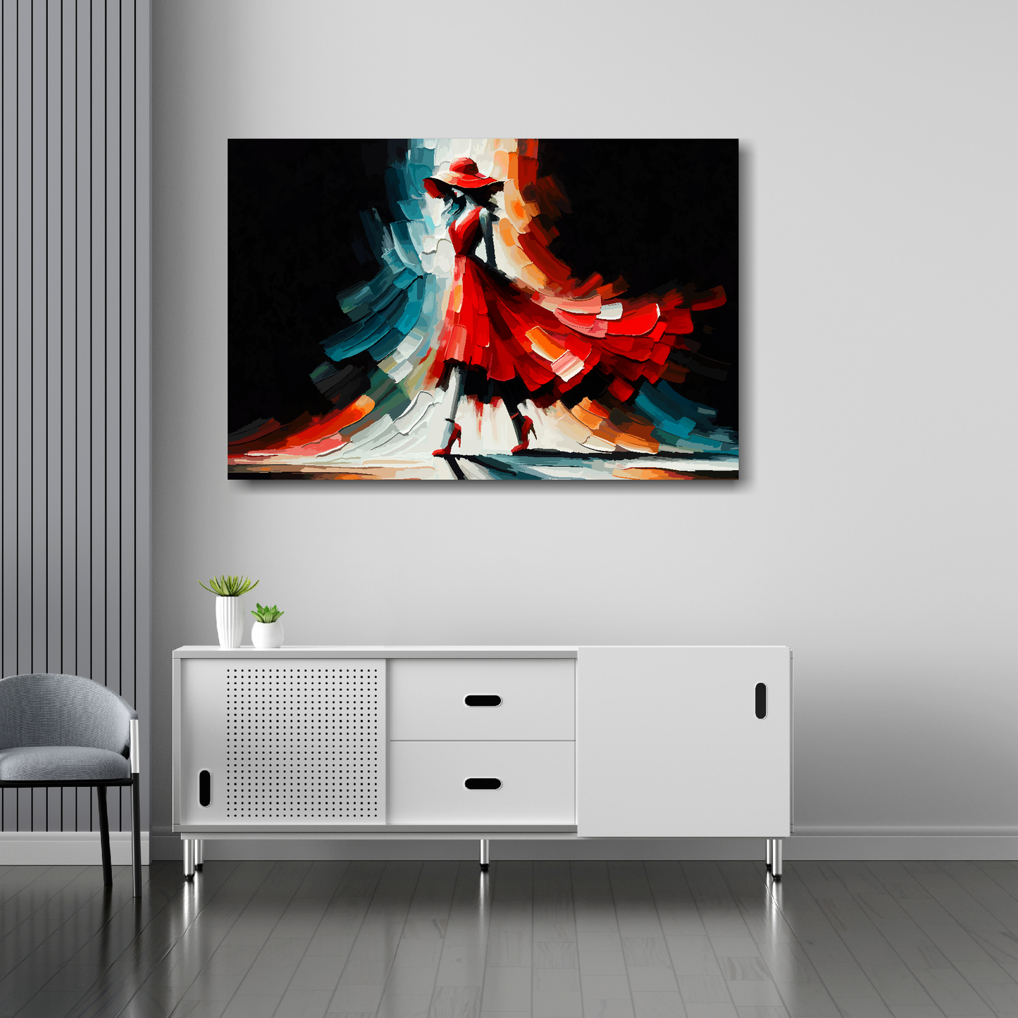 36 inch by 24 inch abstract canvas print of a woman in a red fashion dress. Mounted on a white wall above a white sideboard.
