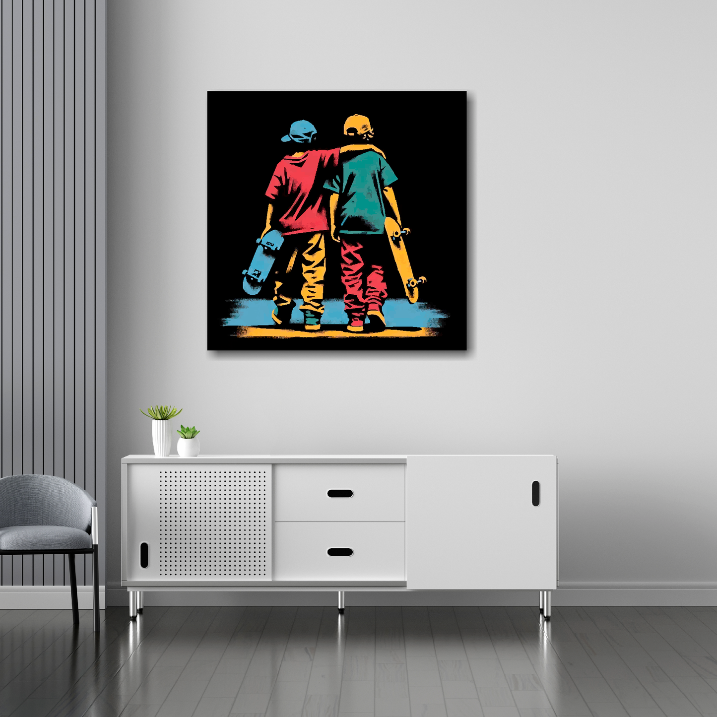 30 inch by 30 inch square canvas featuring a two teen boys with skateboards. Mounted on a white wall above a white sideboard.