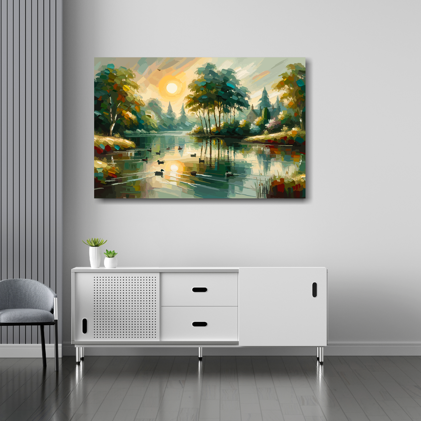 36 inch by 24 inch canvas print featuring an tranquil English lake with setting sun. Mounted on a white wall above a white sideboard.