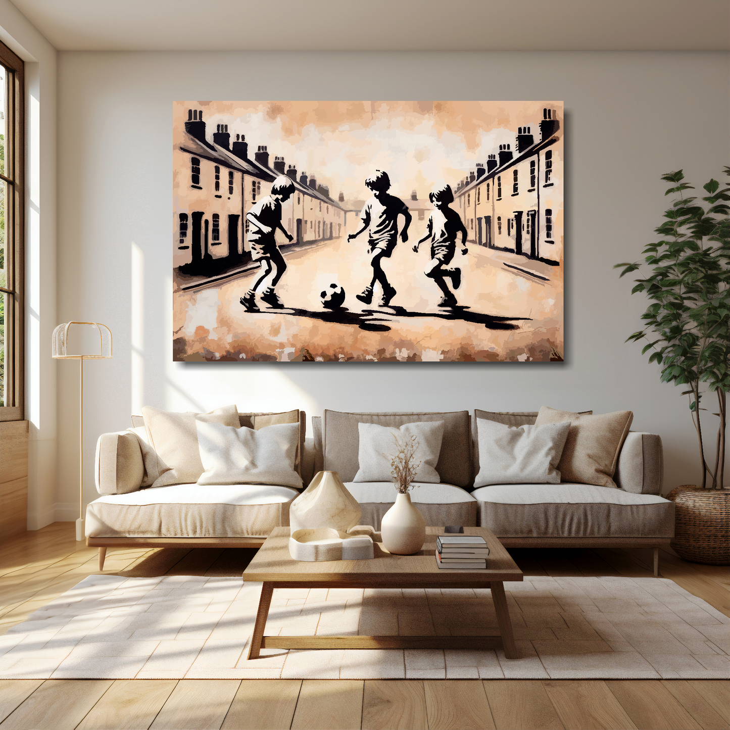 30 inch by 20 inch abstract canvas print of three boys playing fooball in the street. Mounted on a cream wall above a cream sofa with decorative pillows.