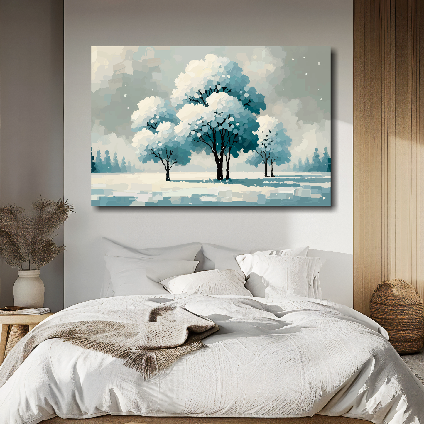 Large canvas print featuring a winter landscape with snow covered trees. Mounted on a white wall above a double bed.