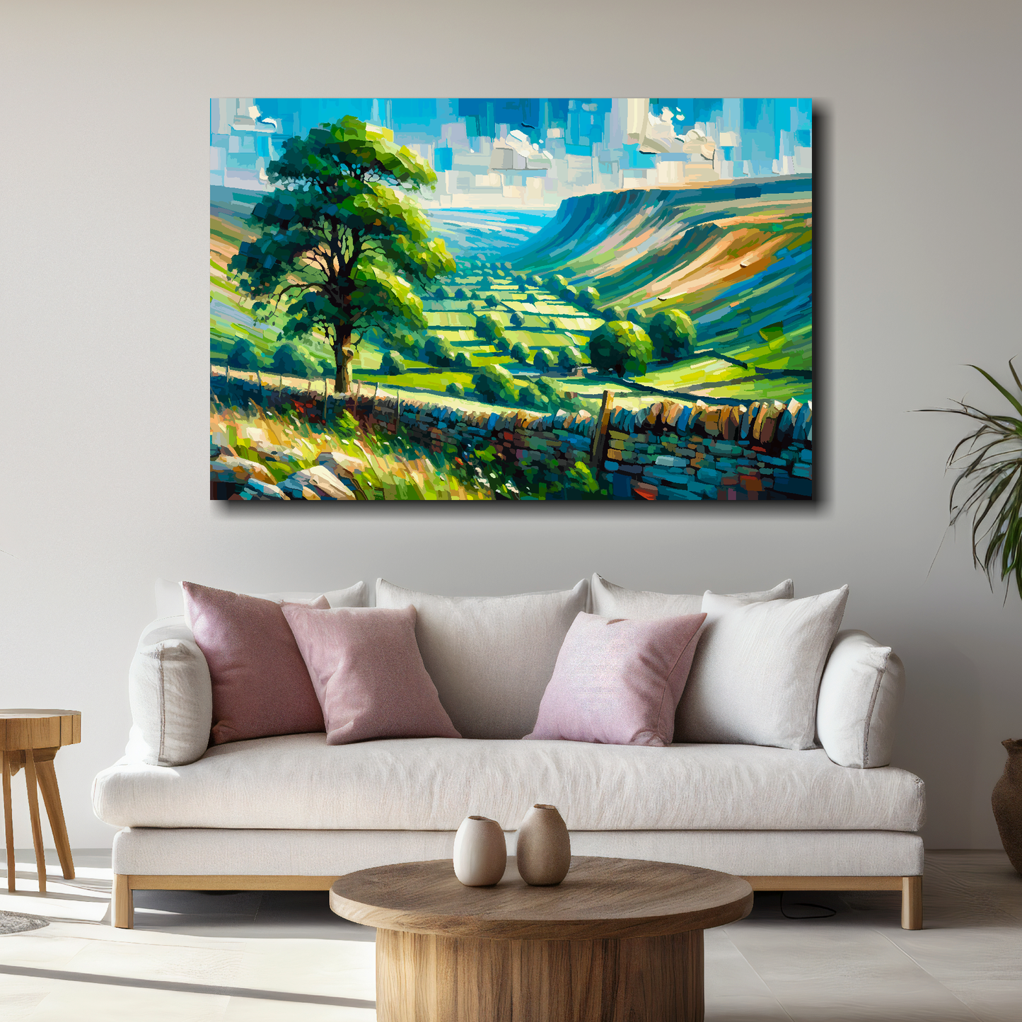 Large abstract canvas print of a Yorkshire Dales landscape. Mounted on a white wall above a white sofa with decorative pillows.