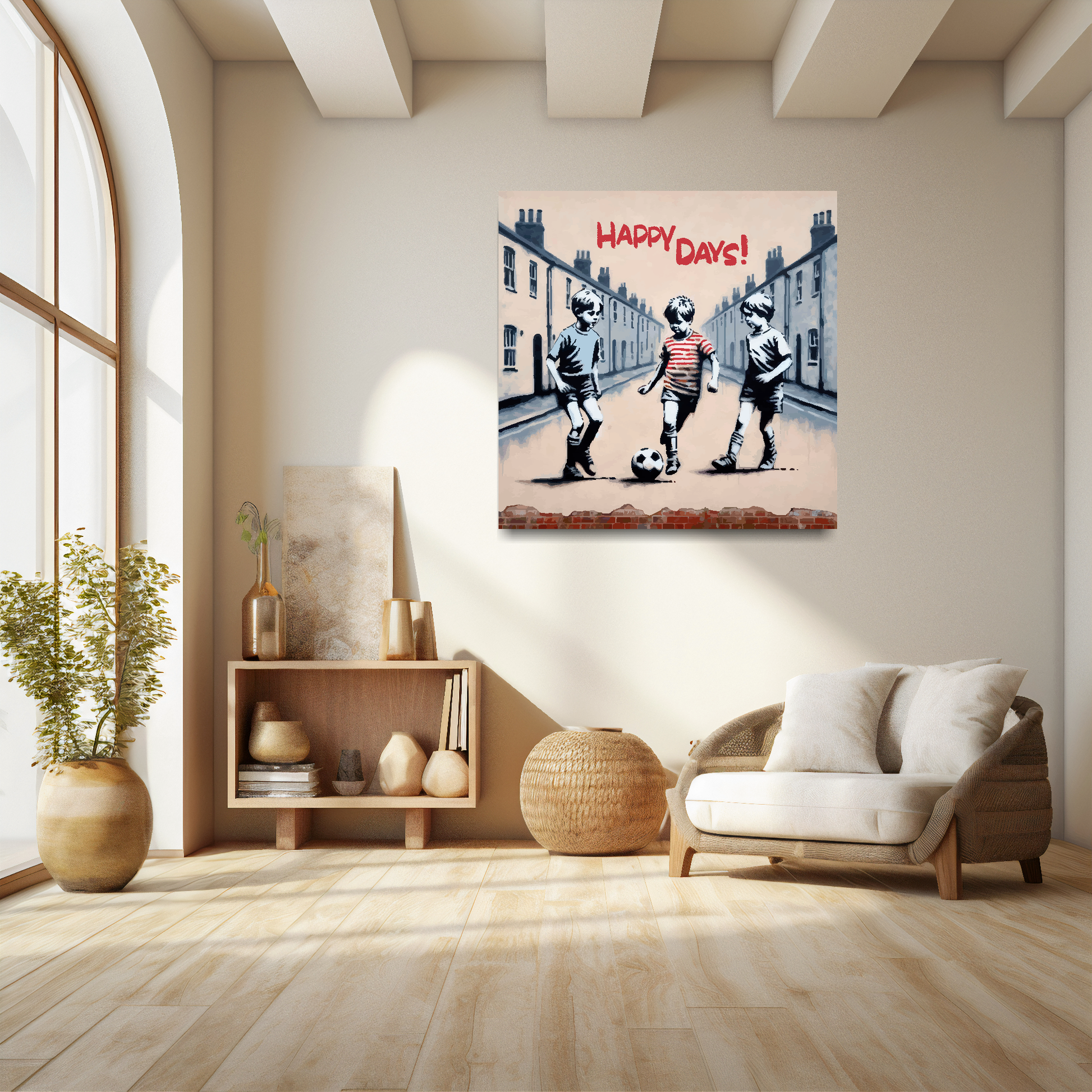 Square XL canvas featuring three young boys playing football in the street, text at the top saying...'Happy Days'. Mounted on a white wall above a white sofa with decorative pillows.