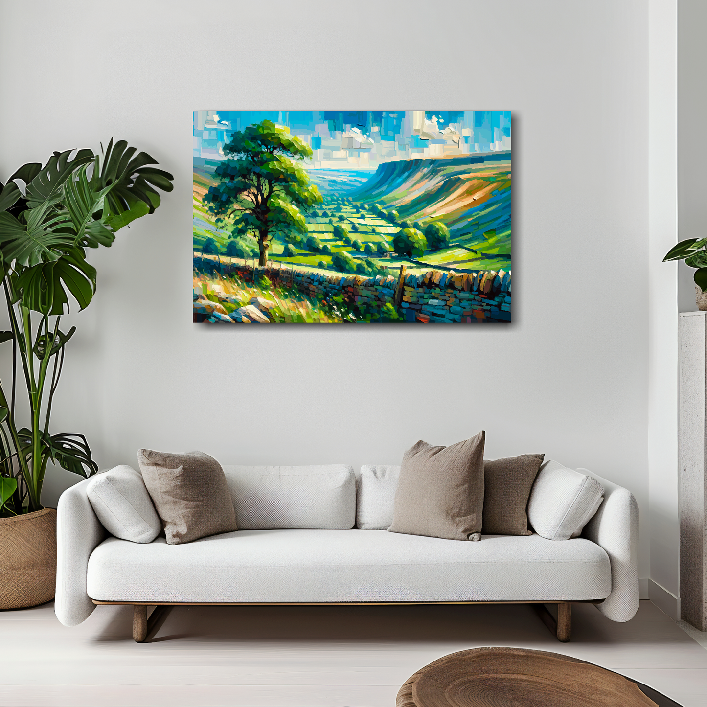 30 inch by 20 inch abstract canvas print of a Yorkshire Dales landscape. Mounted on a white wall above a white sofa with decorative pillows.